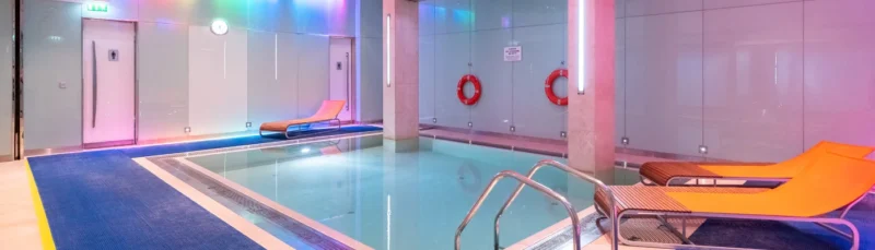 Indoor swimming pool at G-Force Health Club inside Dubai International Hotel Terminal 3.