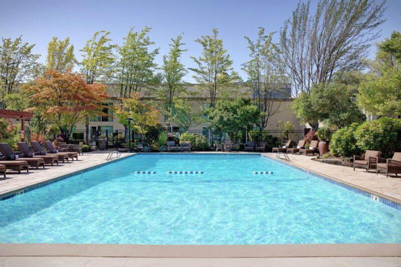Outdoor swimming pool and courtyard at Hilton Seattle Airport & Conference Center.